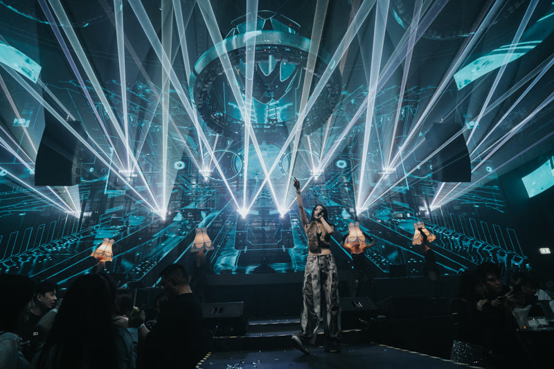 Lasers project over crowd at club